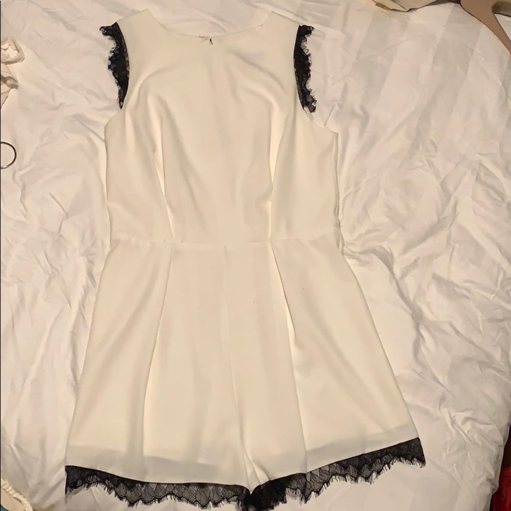 Aqua white romper with black lace trim